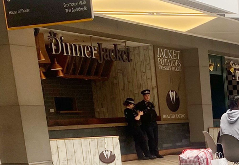 Police on duty in the Lakeside food court this afternoon.