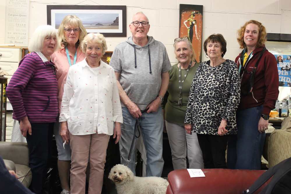 Animal-lover Mike Droy (centre) has supported The Windyway Trust for almost sixty years, and currently volunteers at their charity shops in Macclesfield. One of Mike's current dogs, which Windyway rescued, can be seen at the bottom of the frame. (Image - Alexander Greensmith / Macclesfield Nub News)