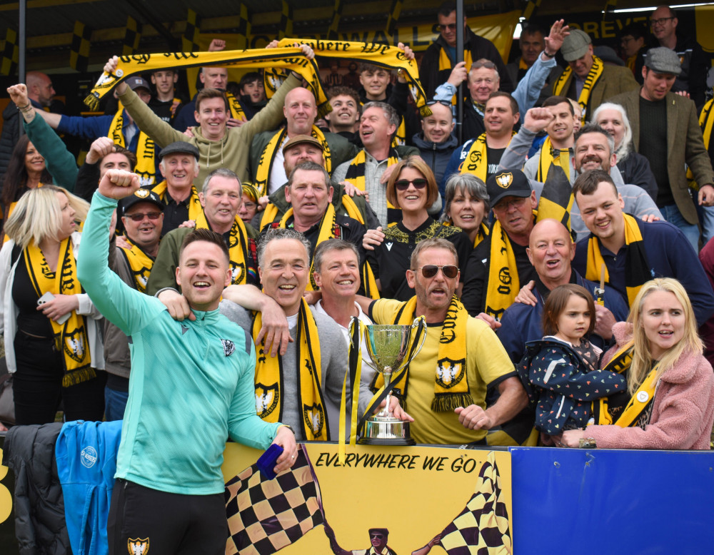 Falmouth Town boss Andrew Westgarth celebrates with the fans. Credit: Matt Friday/Cornwall Sports Media.