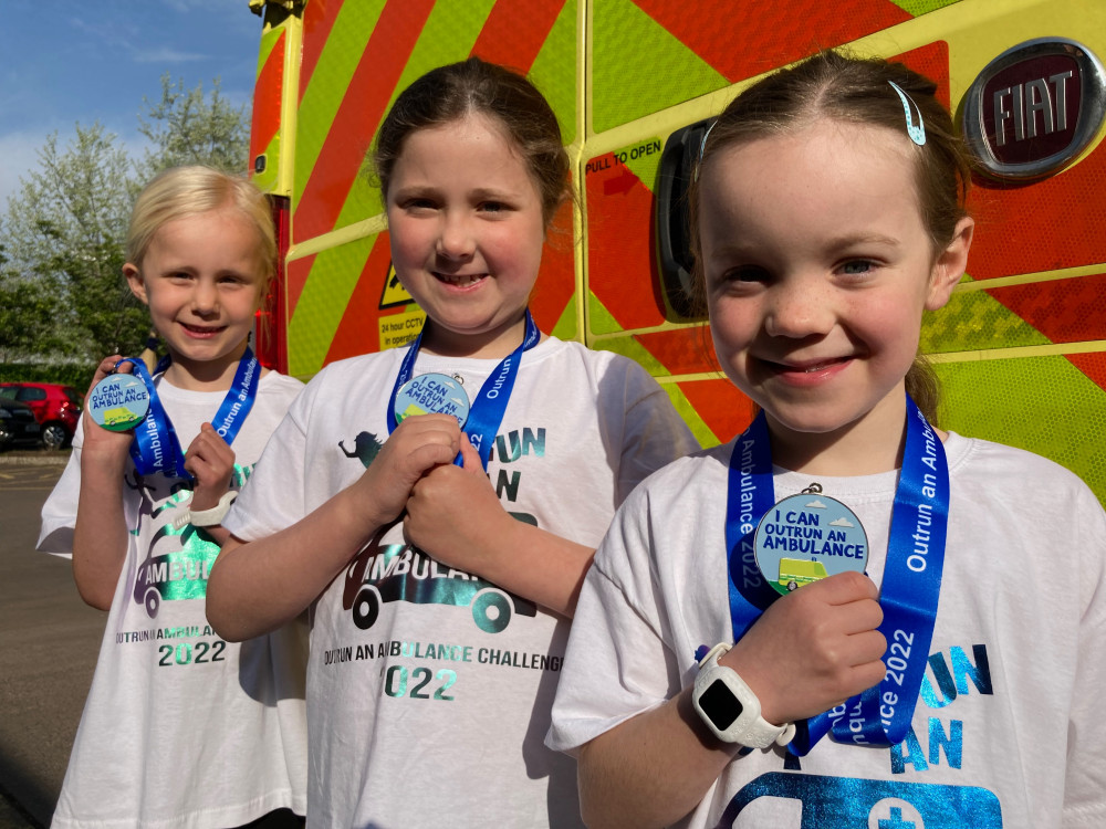 L to R: Emily, Ophelia, and Bea with their 'Outrun an Ambulance' medals (SWASFT)