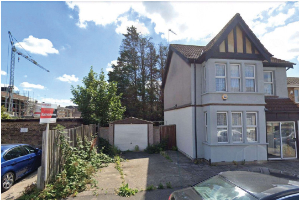 The new building is planned to be built alongside this home following demolition of the garage. 