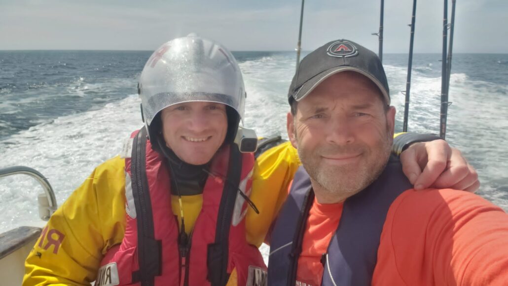 Lifeboat crew member Rich Tilley with fisherman Justin Paull