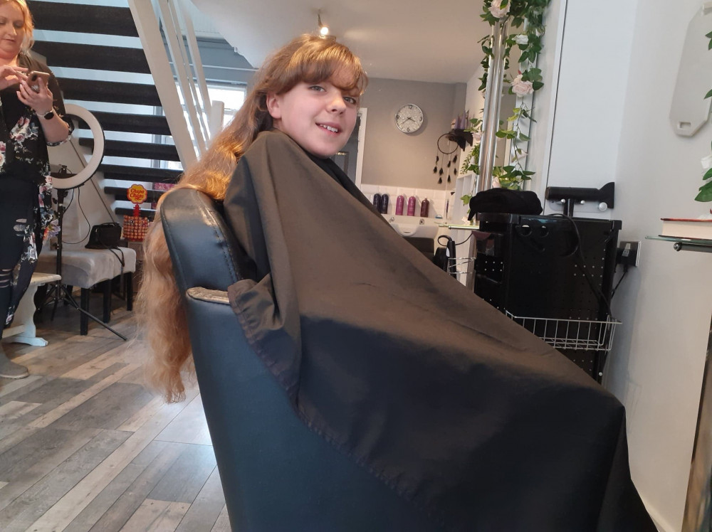 Bethwyn sits in the chair ready for the big chop!