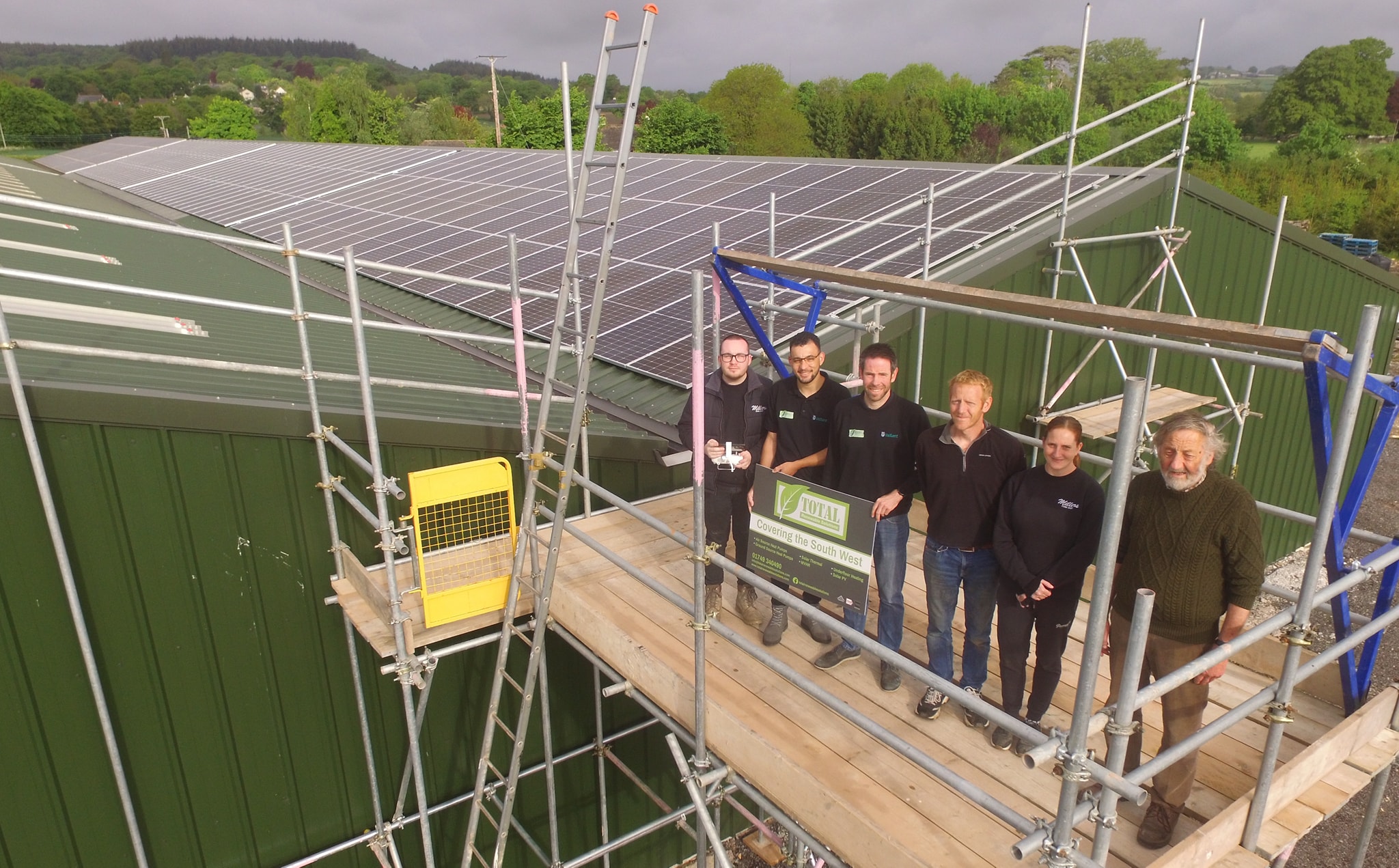 Staff from Millers Farm Shop and Total Renewable Solutions pictured with the panels