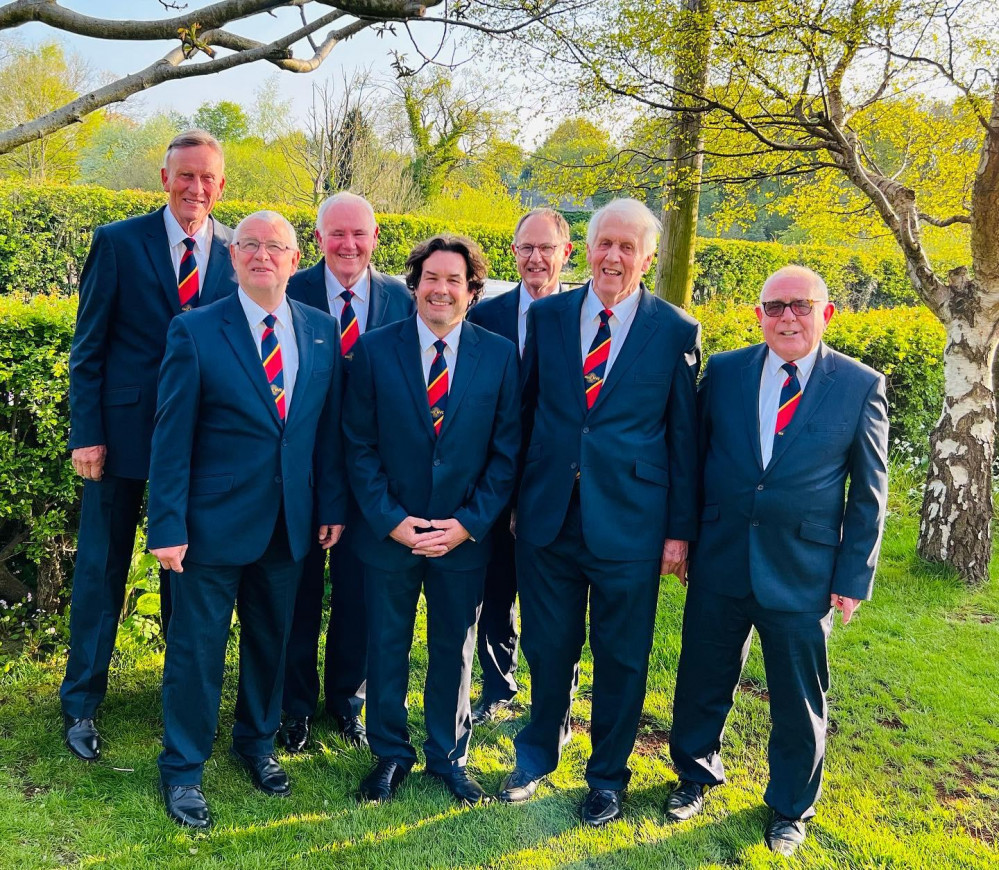 Macclesfield Male Voice Choir with their new suits, which will feature in a performance this weekend. (Image - Macclesfield Male Voice Choir)