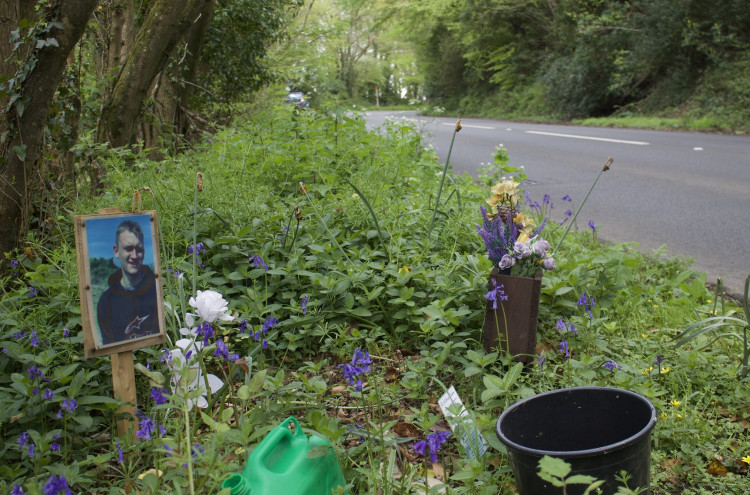A roadside memorial to a man from Exmouth, 20, who died in a crash on the A3052 at Trow Hill in August 2021 (Nub News, Will Goddard)