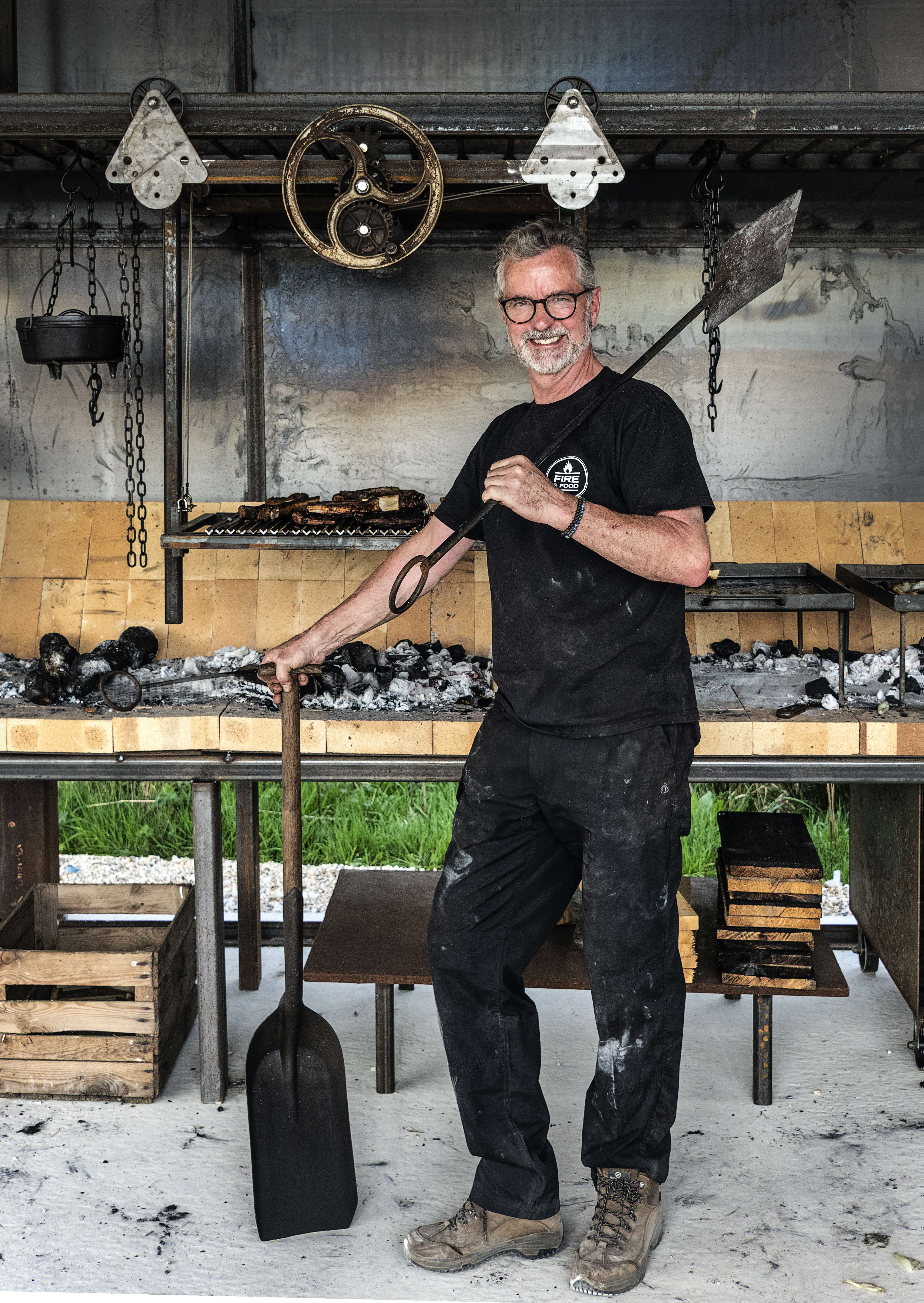 Simon Gudgeon in the new outdoor 'Fire and Food' kitchen