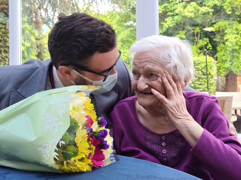 Former nurse Daphne presented with her flowers