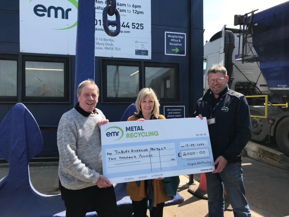 Les Morgan and Annie O'Brien of the Riverside Project receiving the cheque from Michael Webb (right) of EMR.