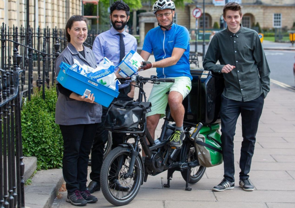 Ruth Paget, dispenser; Ali Hashemian, owner and pharmacist at Pulteney and Bathampton Pharmacy; Philip Thompson, WEGO Bath Courier Site Supervisor; Harry Jones, senior travel & transport officer, B&NES.  ​