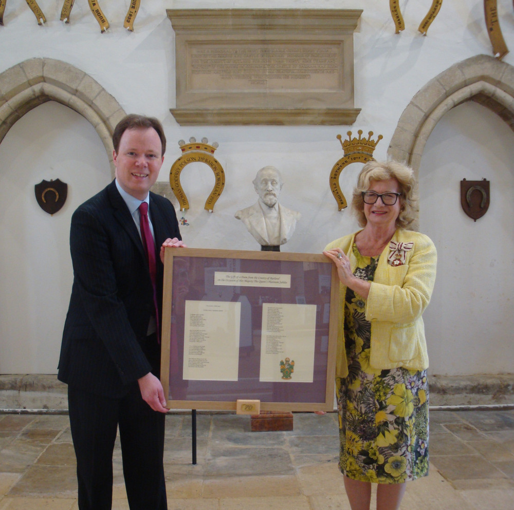 Henry Dawe presenting a framed copy of his Jubilee Poem to the Lord-Lieutenant, Dr Sarah Furness, at Oakham Castle. The small box attached to the bottom of the frame contains a USB stick which will enable a member of staff to show the video of the poem to The Queen on a computer or television set (image courtesy of Henry Dawe)
