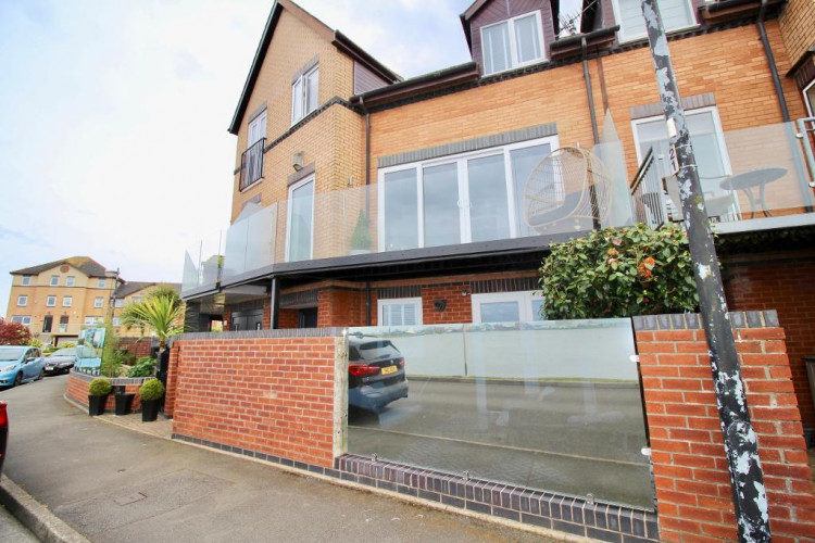 An impressive townhouse overlooking Cardiff Bay on the exclusive Plas Taliesin in Penarth Marina. (Image credit: Seabreeze Homes)