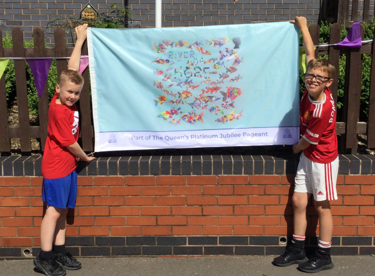  Belmont Year 5 pupils Alfie  (left) and Reece (right) with the flag