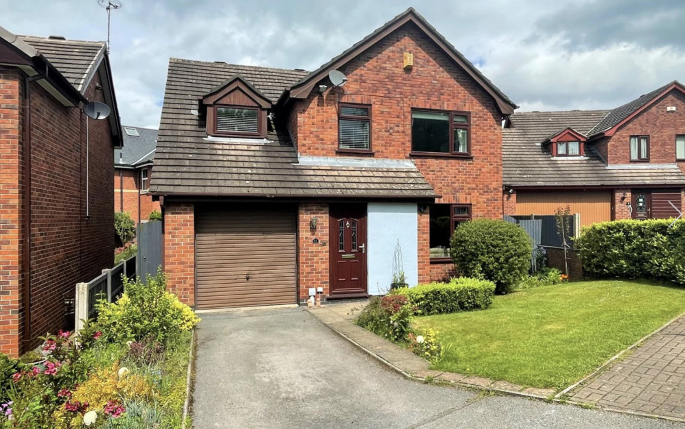 From multiple parking spaces to plenty of shrubs, this Congleton home impresses outside and in. (Image - Stephenson Browne Congleton) 