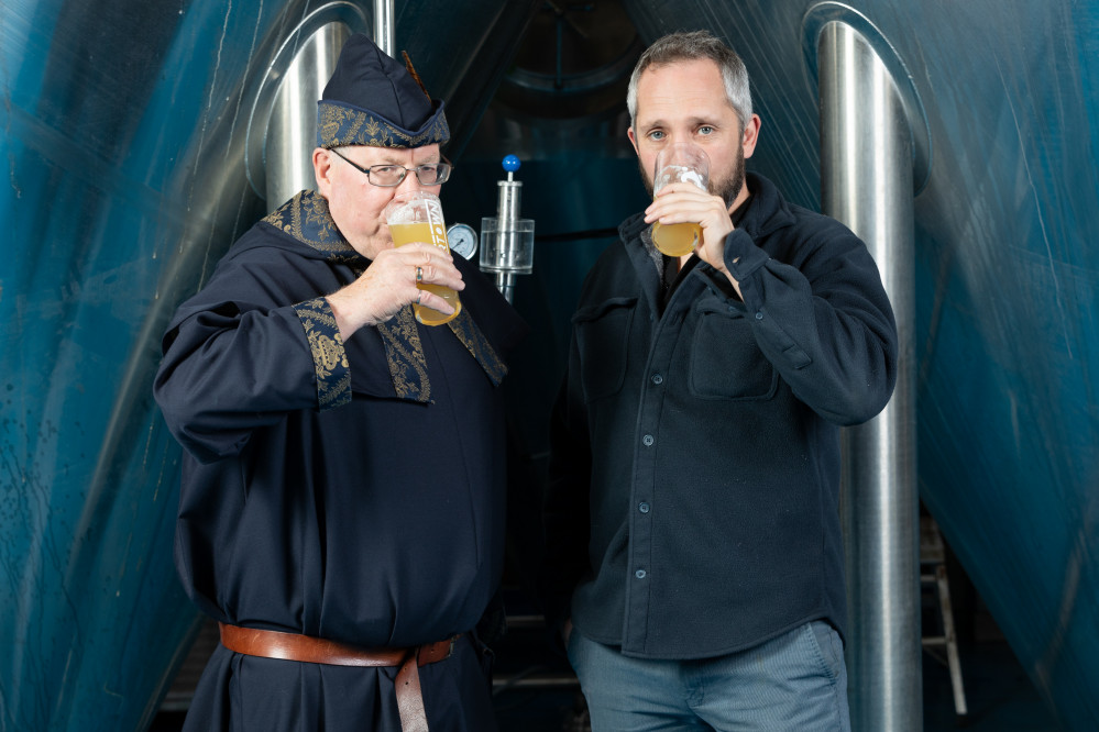 Congleton Ale Taster Benedict Goodale and Beartown Brewery's Joseph Manning enjoy the first sips of the new state-of-the-art brewing tanks. (Image - Down at the Social)