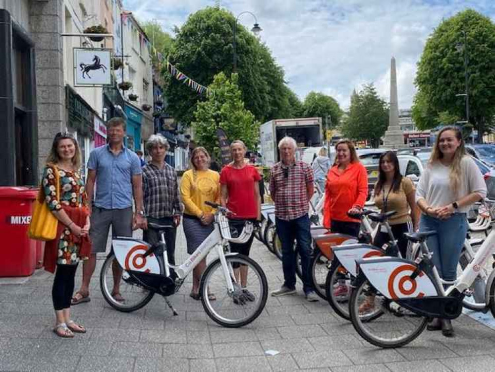 Councillors and cycling enthusiasts celebrate the arrival of the bikes last year.