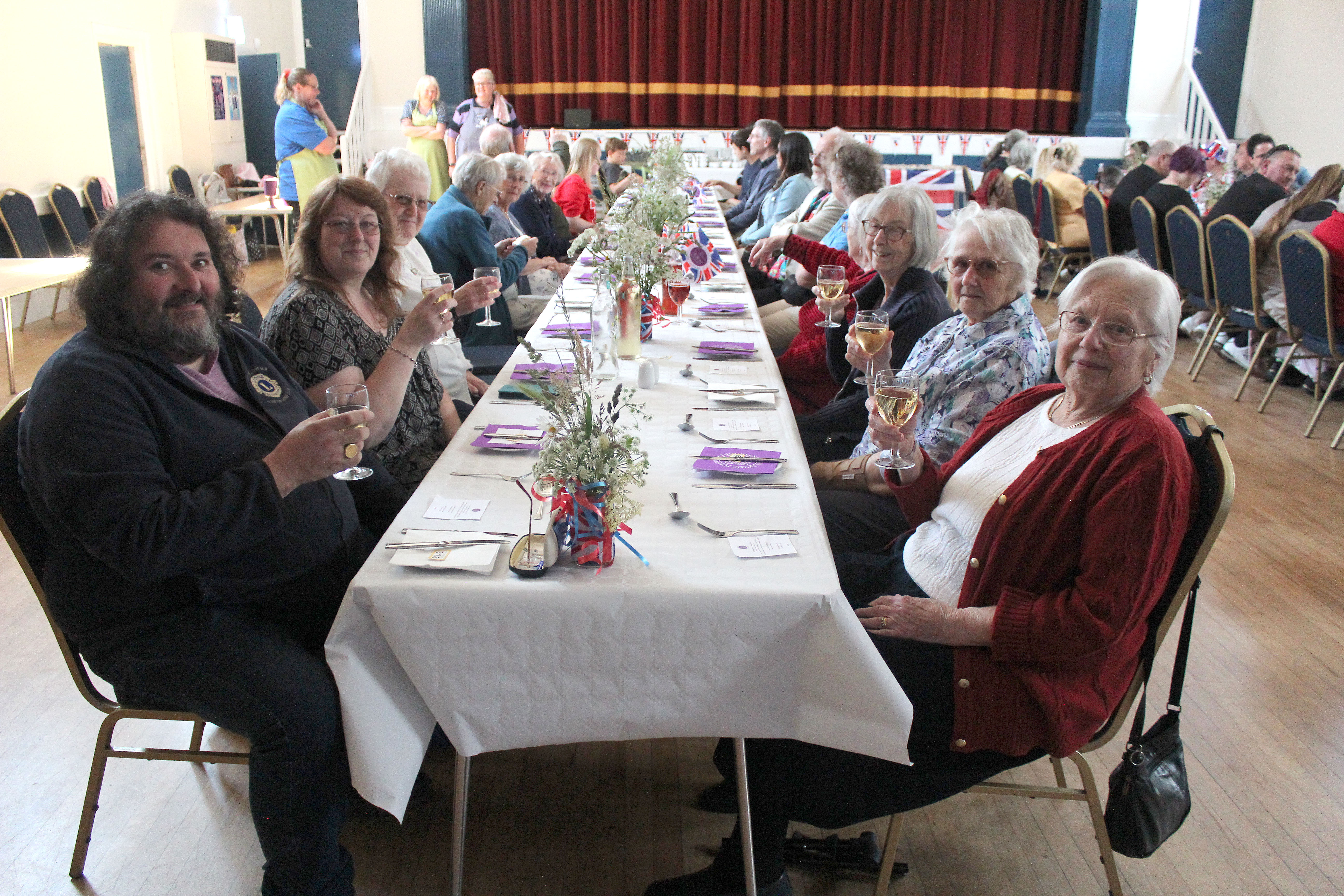 Axminster residents enjoy Nourish's jubilee lunch at the Guildhall