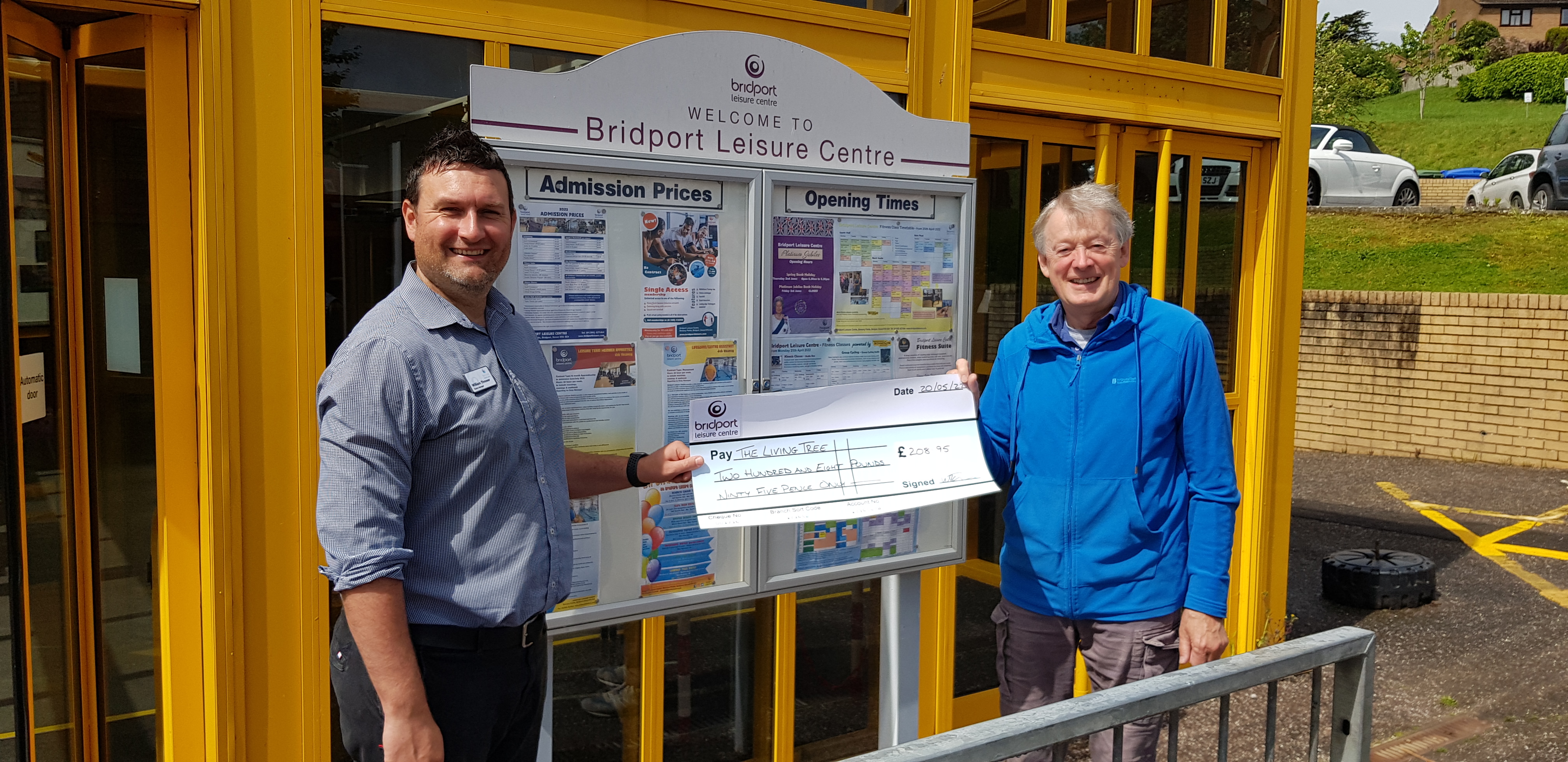 Vince O'Farrell received the cheque on behalf of The Living Tree from centre manager William Thrower