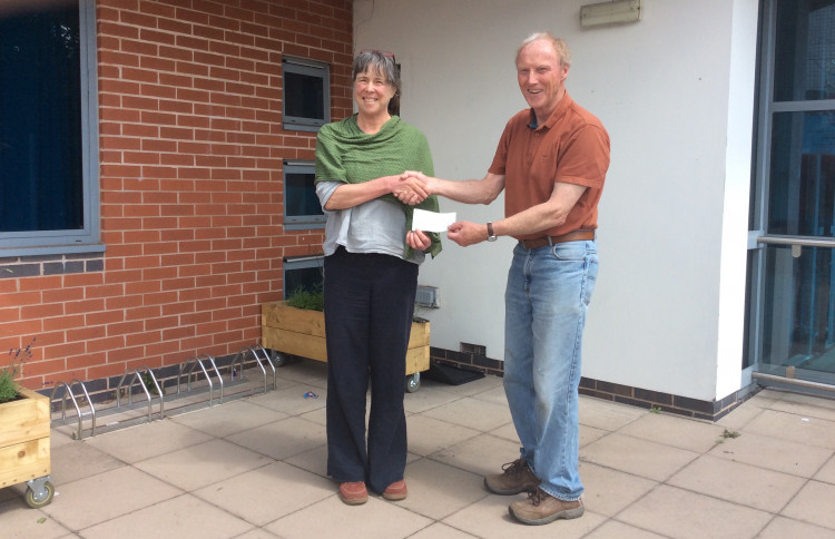 Cllr Peter Jones presents a £2,000 cheque to Louise Male, administrator for the Kenilworth Centre, who manage the Youth Wellbeing Hub