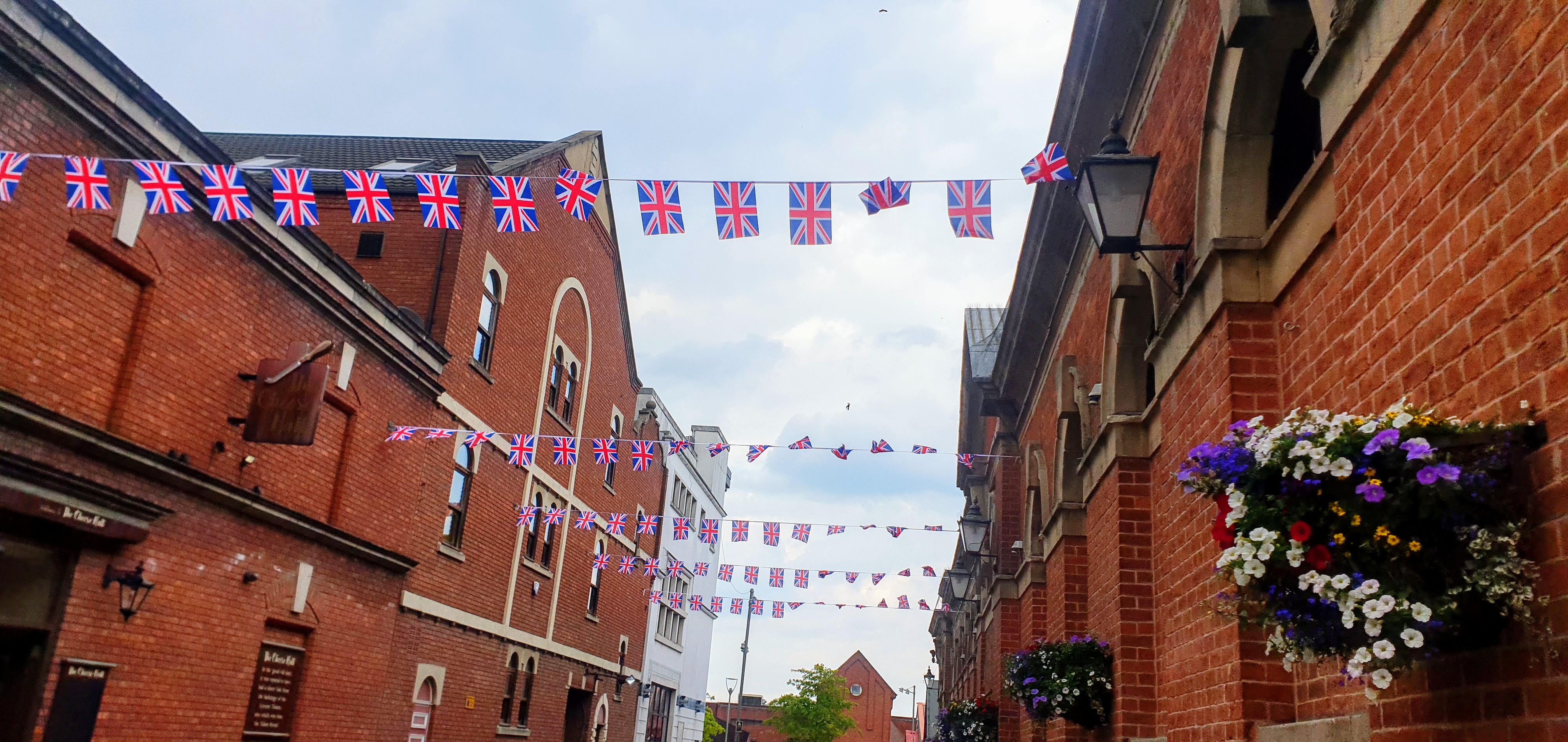 Bunting across Hill Street, Crewe town centre, in-between Crewe Market Hall and The Cheese Hall (Ryan Parker).