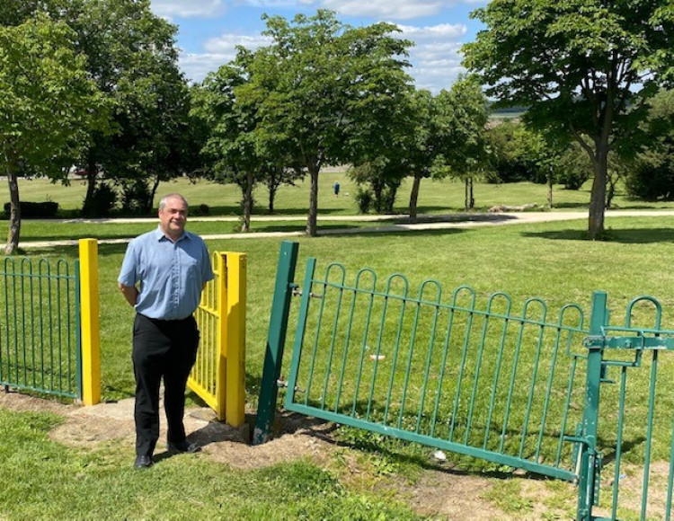 Cllr Shane Ralph by the Corringham Town Park gates smashed up by quad bike riders. 