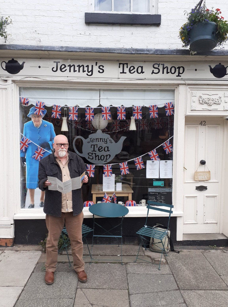 Walking Festival Steering Group chairman, Graham Whitehouse, outside one of the eateries featured on the walks 