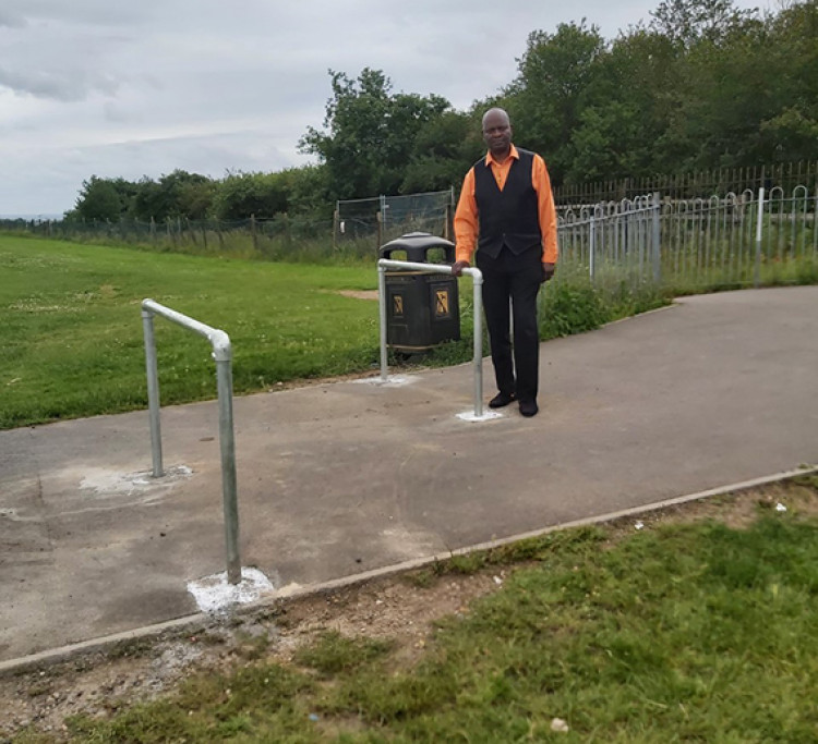 Cllr Daniel Chukwo with the barriers that the council has now acknowledged are not fit for purpose