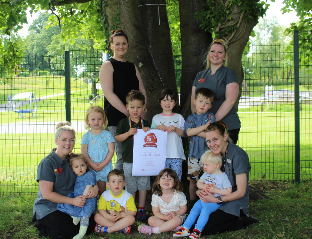 It is all smiles for staff and children outside the Macclesfield nursery. (Image - Busy Bees)