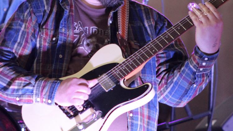 A guitarist performs at Christ Church in Macclesfield. (Image - Alexander Greensmith / Macclesfield Nub News)