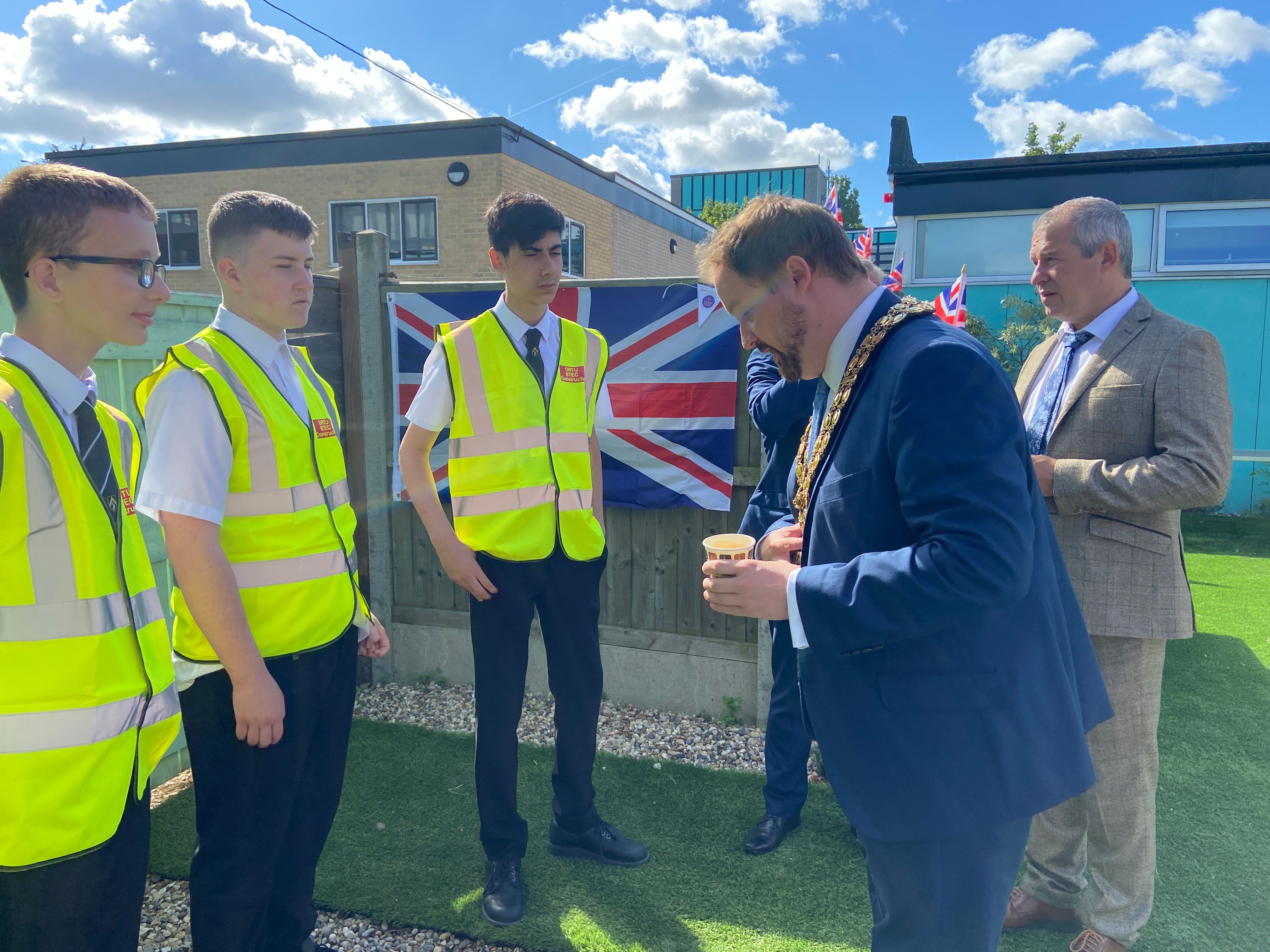 Cllr Halden meets students who constructed the Zen garden.