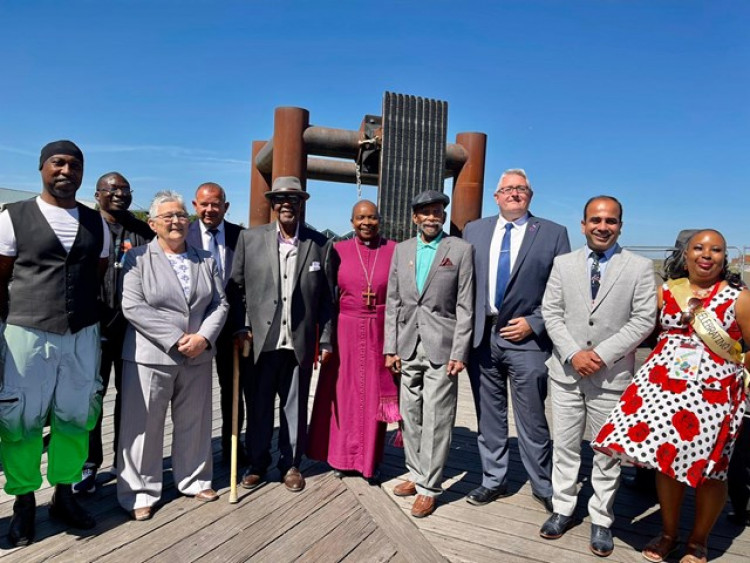 Leader of Thurrock Council Cllr Rob Gledhill and communities portfolio holder Cllr Qaisar Abbas joined by artist EVEWRIGHT and prominent members of the community at Tilbury Bridge Walkway of Memories exhibit today.