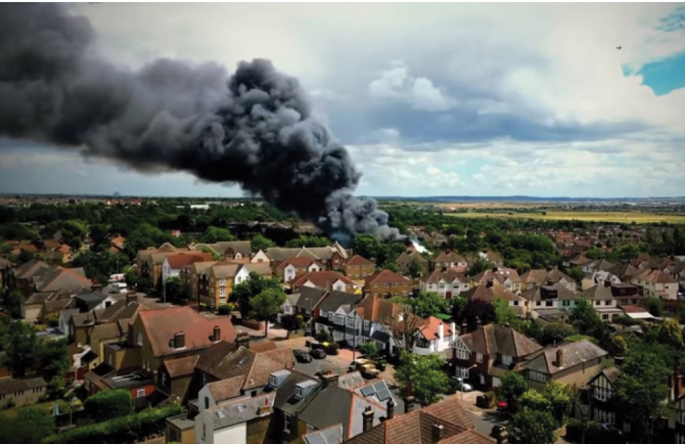 This image shows yesterday's blaze and how close it is to a packed residential area. 