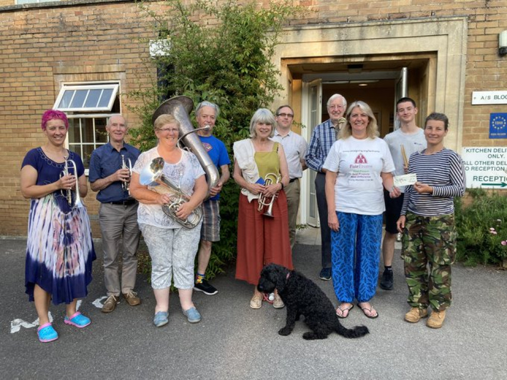 Sounding great even if the dog doesn't look overly impressed - Frome Town Band presented Fair Frome with a cheque for £250