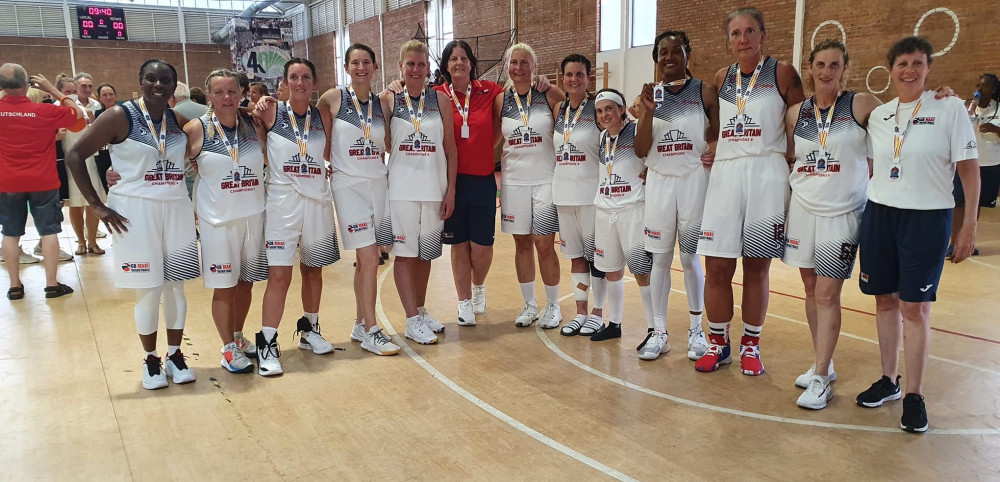 Laura Shemming (sixth from right with strapping) with medal