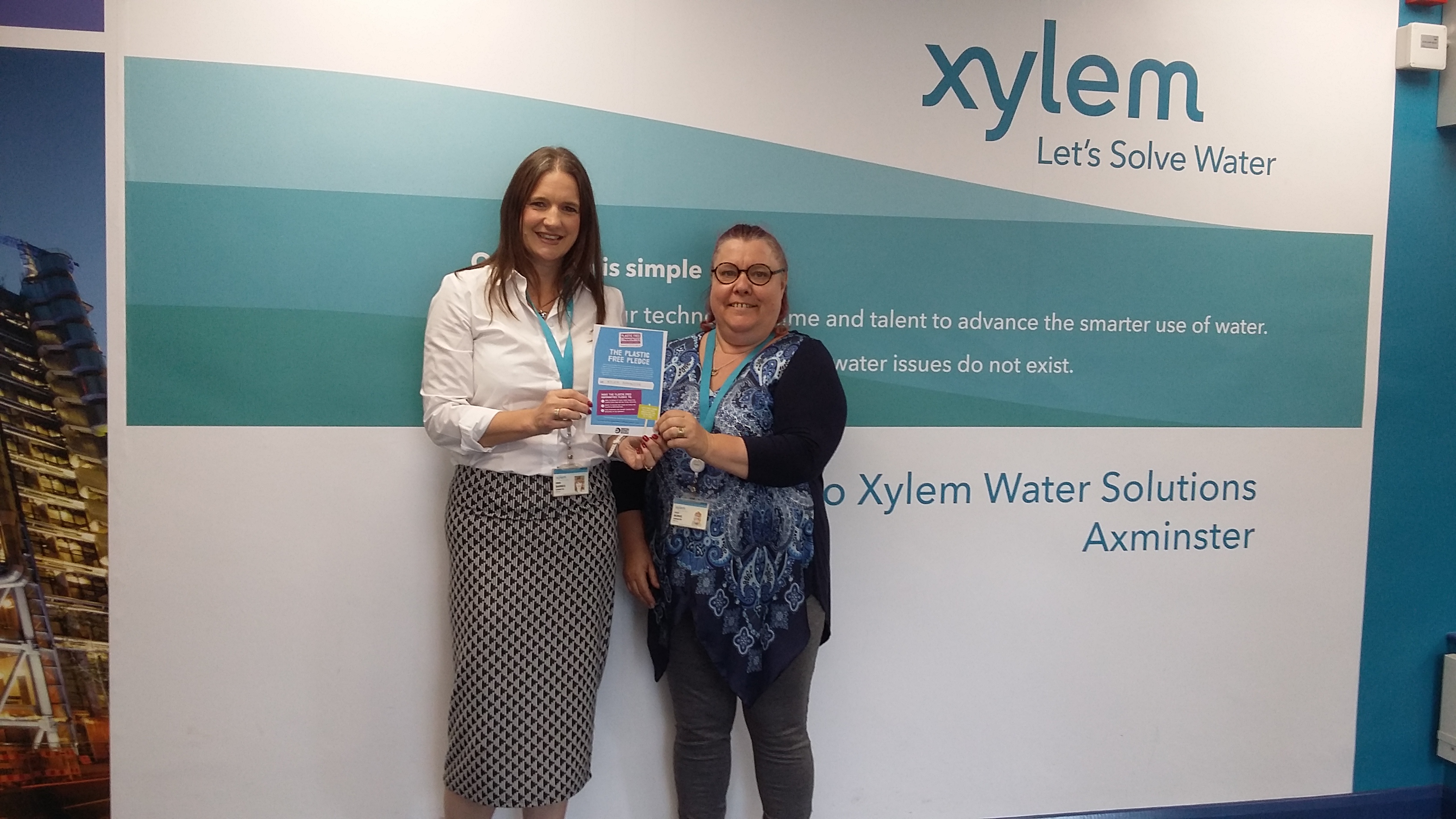 Pictured are Emma Barnes (Internal Communications Manager) on the left and Julie Burke (Tendering Manager) on right with the Plastic Free Pledge