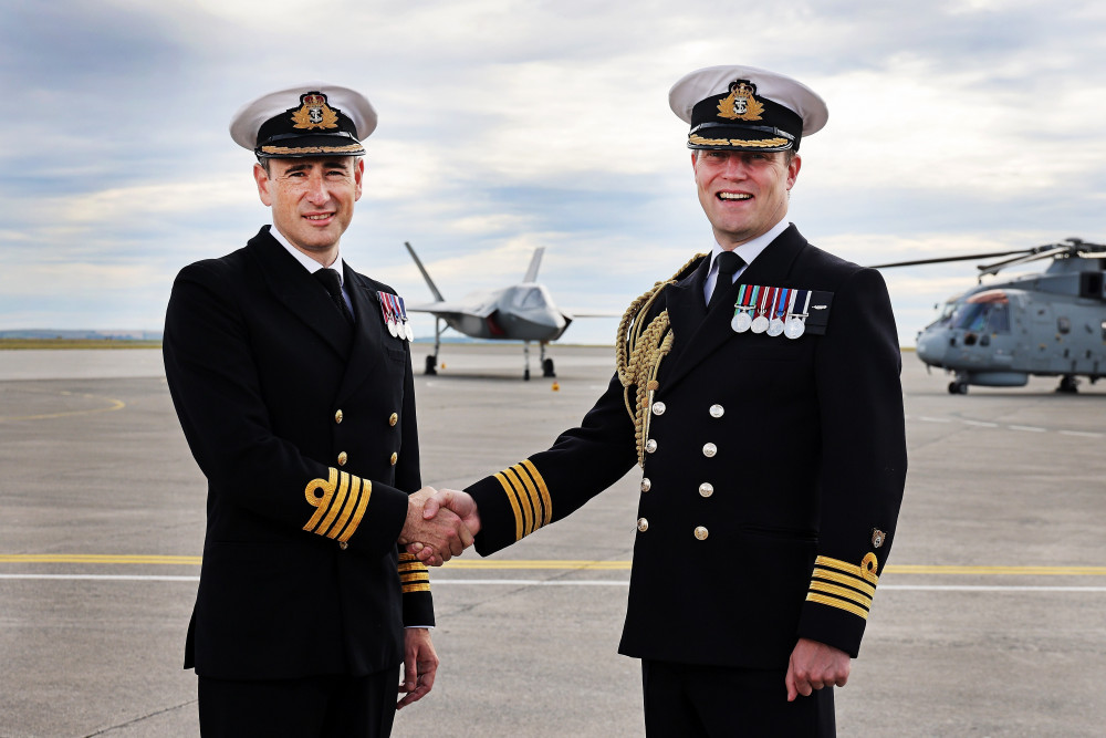 Captain Stuart Irwin (left) takes command from Captain Stuart Finn.