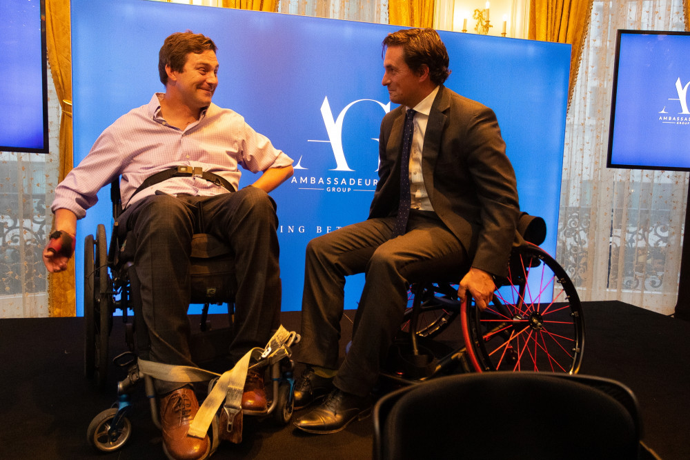 Rob Bugden, left, presented with a custom-built sports wheelchair by Johnny Mercer MP, right. (Image credit: Topline PR Ltd)