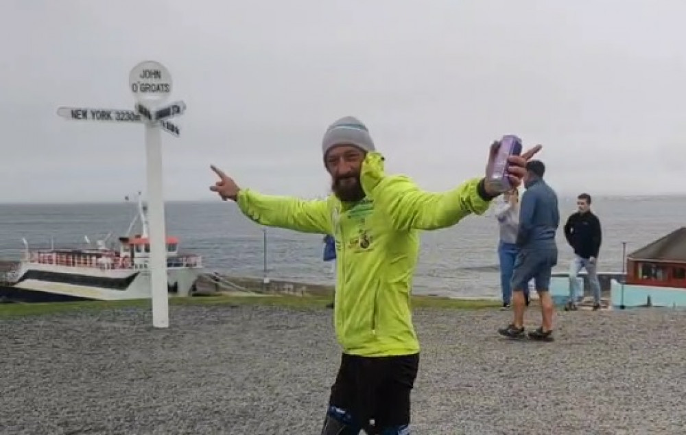 Mitch livestreamed the end of his run on Facebook and enjoyed a well-earned drink once he reached John O'Groats!