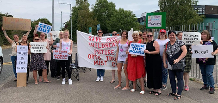 Angry mums make their point outside Gable Hall today.