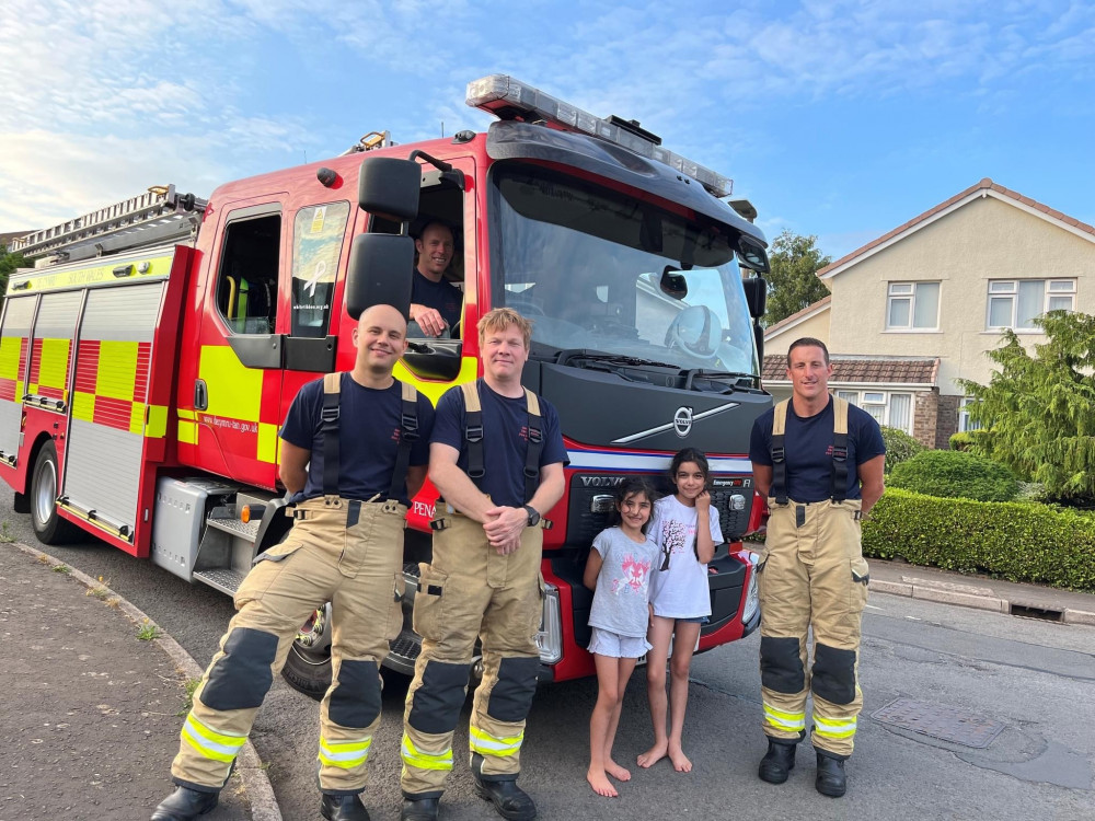 Lana, 8, with Penarth firefighters. (Image credit: South Wales Fire and Rescue Service)