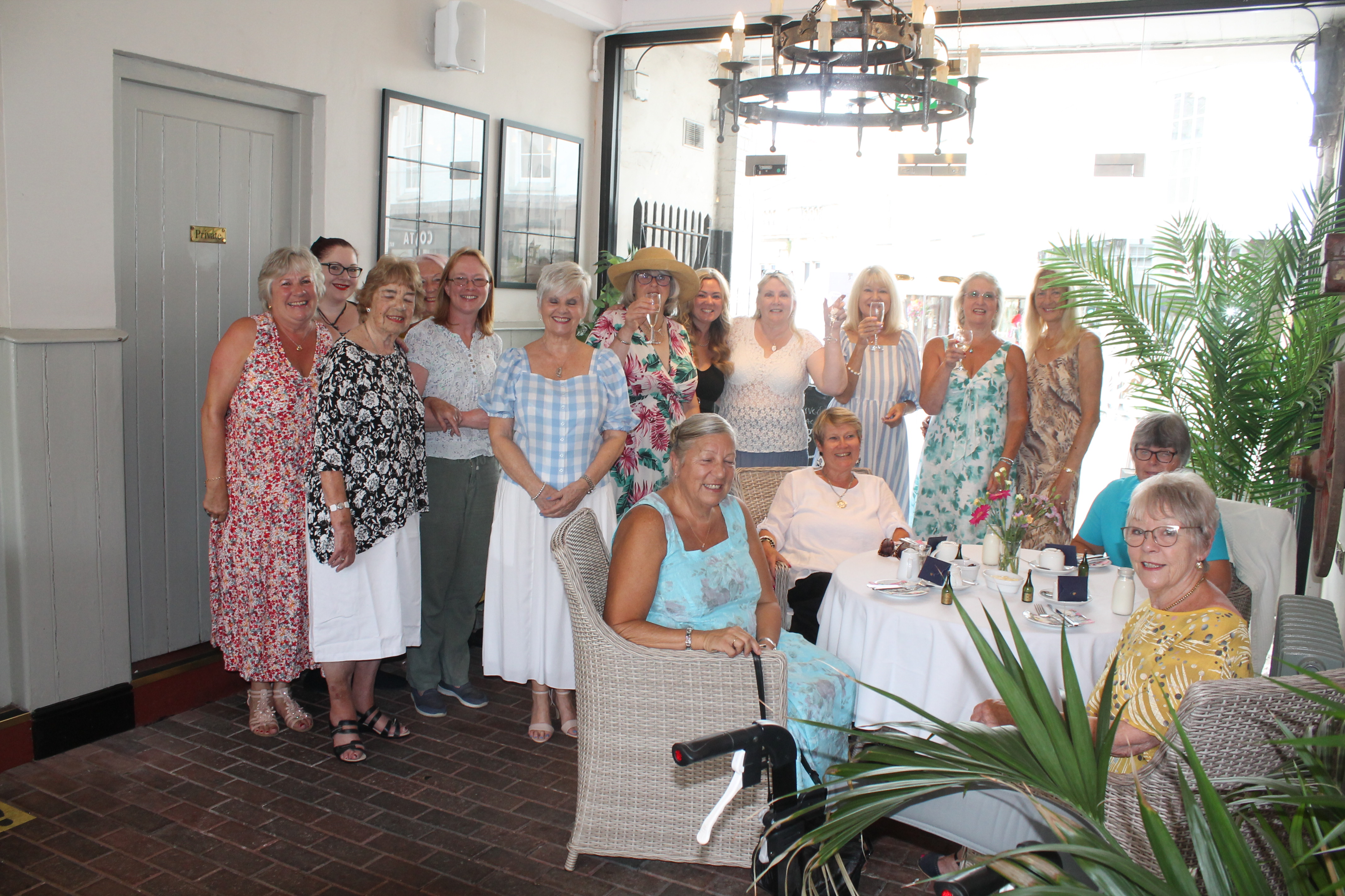 CHEERS! Axminster Ladies Group raise a toast at their first anniversary cream tea.