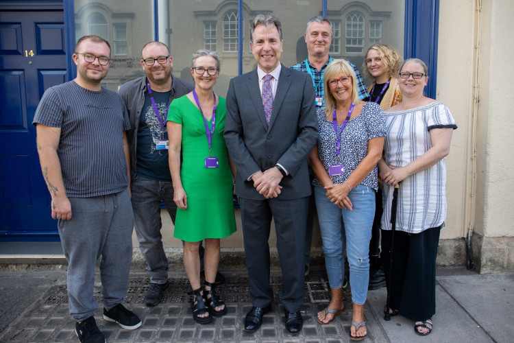 Attached is a photo of Metro Mayor Dan Norris at the launch of the West of England Peer Academy. Pictured are Jack Gill (course participant), Luke Lowes (course participant), Rosie Phillips (DHI CEO), Mayor Dan Norris, Ron Holdaway (course participant), Carolyn Rogers (DHI), Savannah Bassewitz (DHI) and Tor Purnell (course participant)