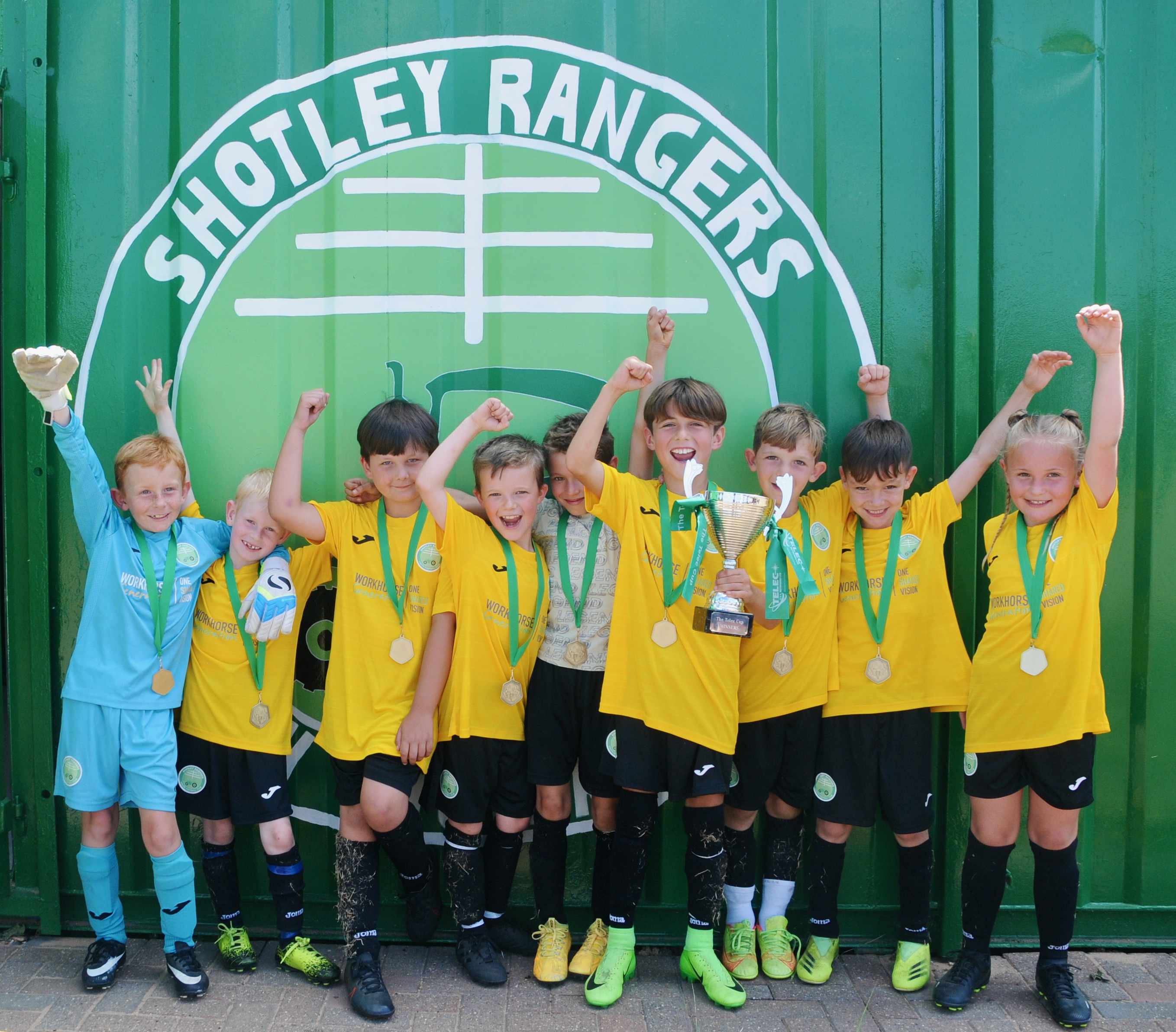 Young Shotley Rangers players lift Telec Cup (Picture credit: Peninsula Nub News) Young Shotley Rangers players lift Telec Cup (Picture credit: Peninsula Nub News)