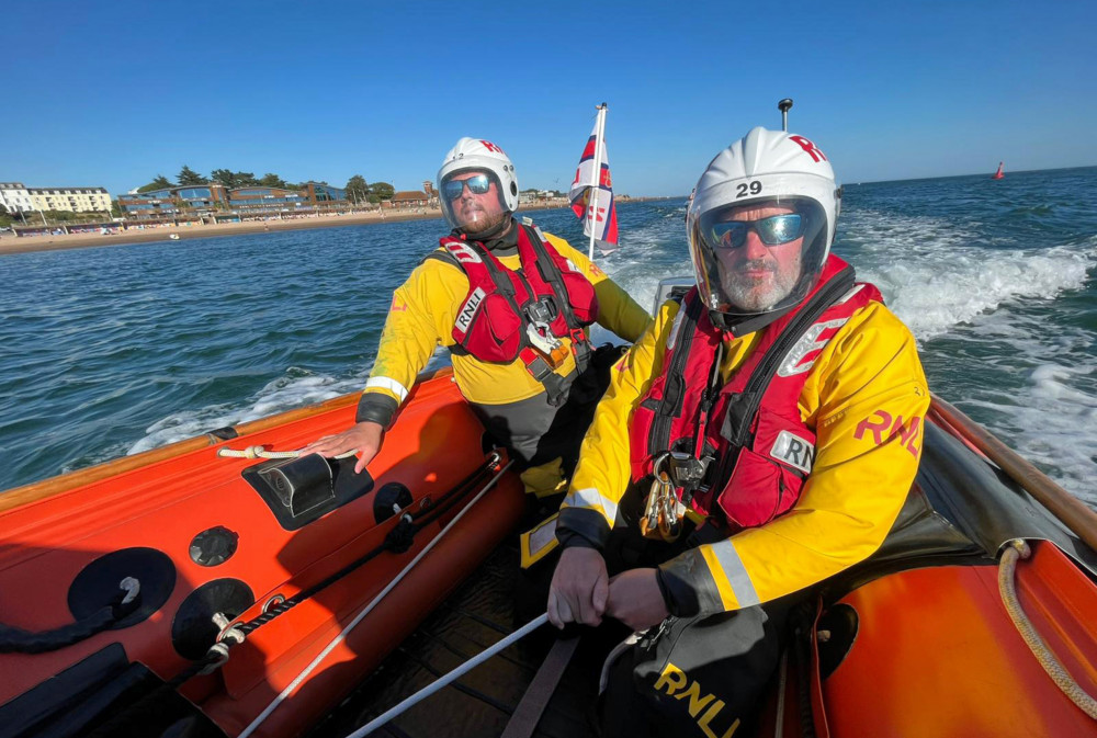 Exmouth inshore lifeboat crew towing the broken down boat (Nick Wright/ RNLI)