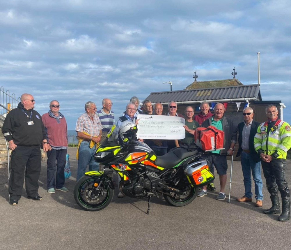 The Royal Antediluvian Order of Buffaloes' (Buffs) of Beer brothers presenting the cheque for £3,000 to the Devon Freewheelers (photo: Buffs of Beer)