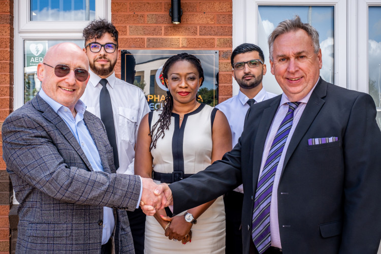 Alpha Omega owner, Ken Lawton, with the firm’s legal director, Amaka Lawton, new recruits and Alf Murphy of Employment Law Solutions at its Crewe Business Park headquarters (Jan Roberts).