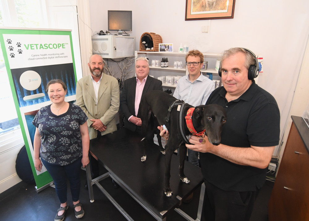 From left: Victoria Yardley, Ian McFarlane-Toms, Cllr Martin Watson, Alistair Foster, and Hugh Duffin using the VetaScope on Parker the dog