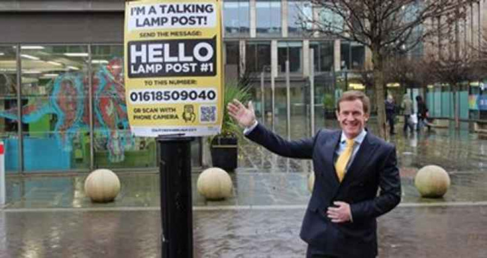 Cllr Alan White by one of the signs