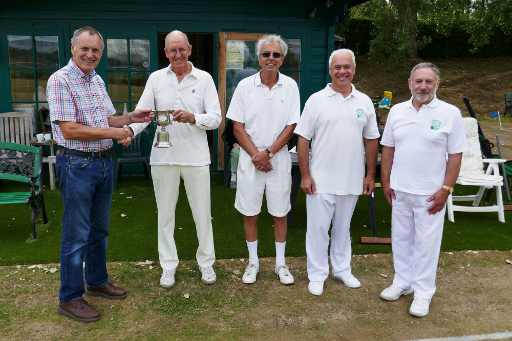 Adrian Morris, West Midlands Chair, presenting the trophy to captain Philip Wood with teammates Mervyn Harvey, Phil Mander and Phil Blake