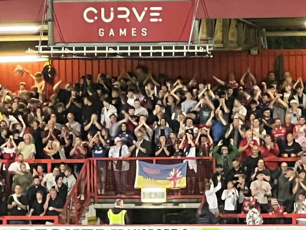 Boro fans celebrate on the East Terrace after Stevenage beat Rochdale 1-0. CREDIT: @HitchinNubNews 